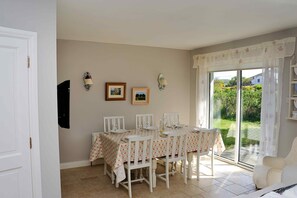 Dining area with 40' TV mounted on the wall