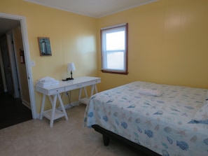 Queen bedroom has a desk for work or school