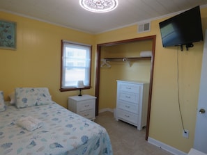 Queen bedroom has large closet and plenty of storage plus a smart tv