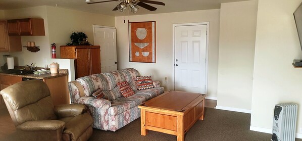 Top of coffee table raise to be a game table. Comfortable Recliner.