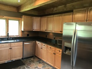 new kitchen floor, appliances and granite countertop