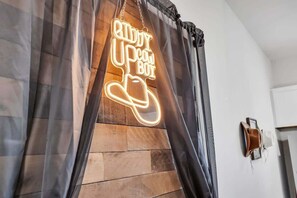 Neon giddy up cowboy sign. Lots of photo opportunities to have!