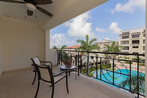 Relax anytime of the day on your spacious balcony and enjoy a nice view of the resort and pool