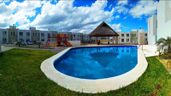 Get family fun at the pool in front of the house.