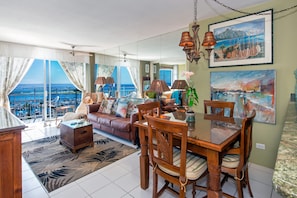 Dining area, Living room with Lanai and ocean beyond
