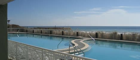 View of the large heated freshwater pool & Gulf of Mexico just steps from patio