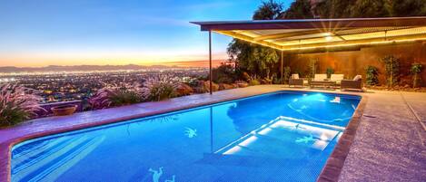 Sparkling pool looking out at mountain & city views w/ spa & poolside gazebo