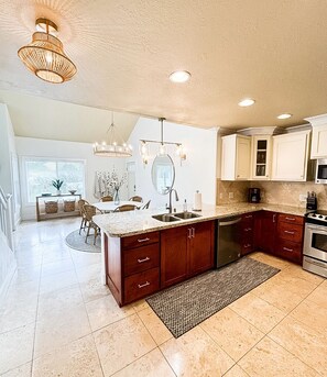 Updated kitchen with granite counters and high end amenities