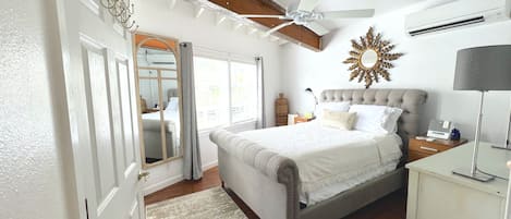 Bedroom w/lots of natural light and blackout curtains, ductless air & cozy bed!