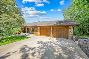 Two car garage and parking space for lots of vehicles. There are 2 additional parking pads as well as a very long driveway.