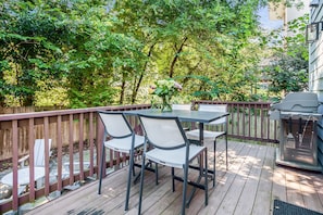 Outdoor Dining Table, Chairs, and BBQ Grill in the Backyard Deck.