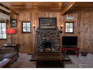 Original 1921 river rock fireplace and chimney with gas log set