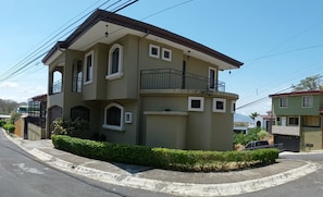 Corner lot for privacy and balconies on each side of the house.