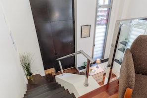 Modern staircase leads to the master bedroom