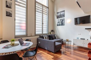 Floor-to-ceiling windows illuminate the space