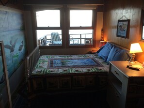 Queen size bed overlooks lake, hear water against the shore and loons at dawn