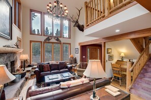 Living Room with trophy wapiti, desk shown.