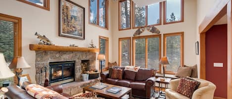 Living Room, window seat behind far sofa.