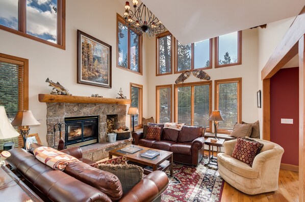 Living Room, window seat behind far sofa.