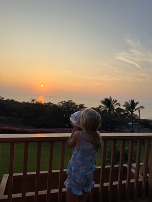 Guest w/concho shell at the end of day sunset traditiion, then end of vacation