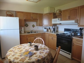 Full kitchen with washer and dryer