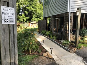 Guest parking for 2 cars, down at bottom of driveway, steps away from entrance.