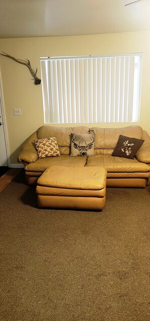 7' Leather Couch and large Ottoman. 
Elkhorn  Coat Rack. 