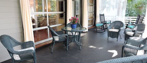 Outdoor, Southern porch with views of the palm trees and beautiful flowers