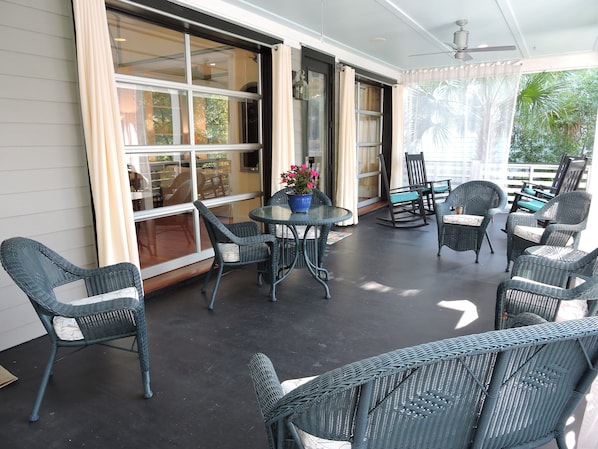 Outdoor, Southern porch with views of the palm trees and beautiful flowers