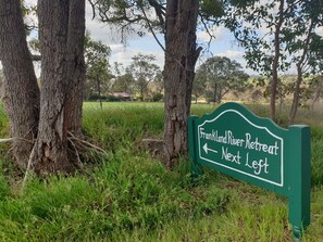 Front signage on roadside before entrance to Frankland River Retreat