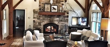 Light filled great room, soaring fireplace, post and beam architecture....