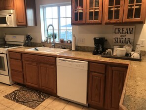 Beautiful new kitchen with new dishwasher, sink and faucet sprayer combo