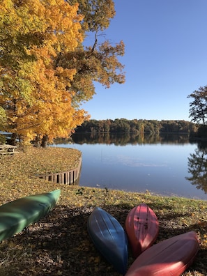 Canoe, kayaks, and calm water. Beautiful Lake Sara in the Fall.