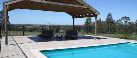 Day beds  next to private pool