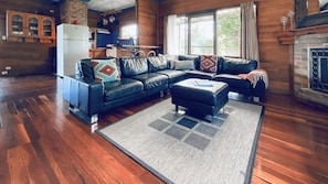 Lounge area in cottage - sofa for 6, a sofa for 2 and open natural fireplace