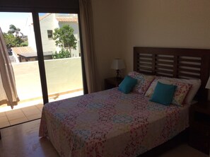 Main bedroom with balcony and ensuite bathroom