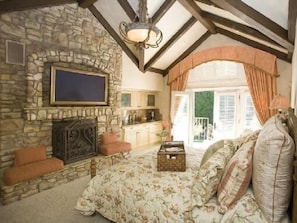 First Floor Master Bedroom with vaulted ceilings and French doors to outside