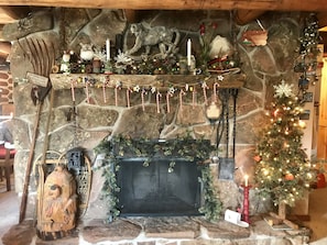 View of fireplace decorated for the holiday season