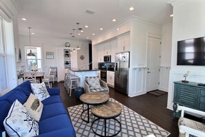 Great room view with tall ceilings and abundant natural light