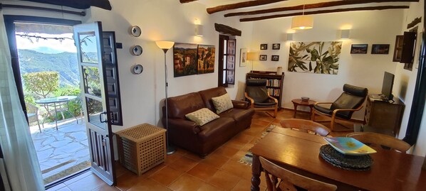 Spacious living room with access to terrace.