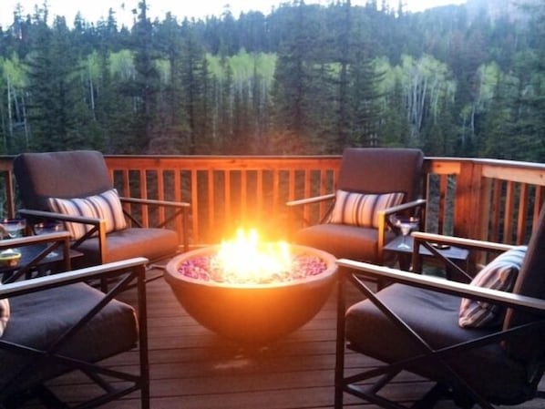 Inviting Fire Pit to warm you on cool evenings while you relax in comfy rockers