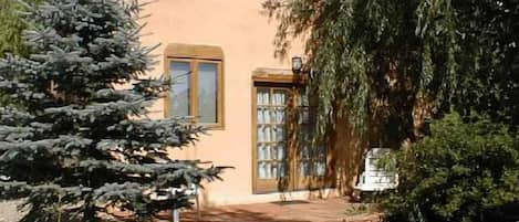 Front entry and flagstone patio summer view of Casita Bella