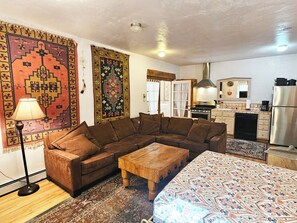View from living area to fully equipped kitchenette