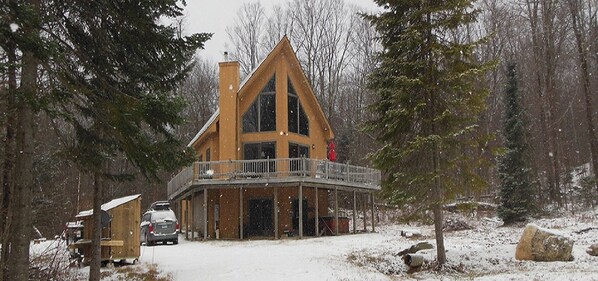 A view of the house looking up the driveway after some early season snow.