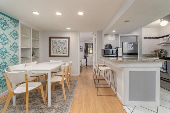 dining area with kitchen and breakfast bar