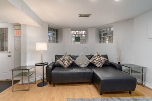 tv room sofa with side tables and coffee table