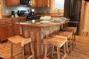 Up-cycled metal and pallet details throughout the home.