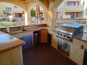 pool side kitchen, with bbq, fridge, washrooms