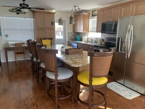 Kitchen area with large eat around island.