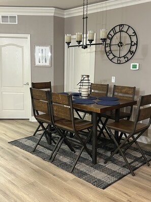 Table for 6 , new rug under table.  More seating at breakfast bar area.